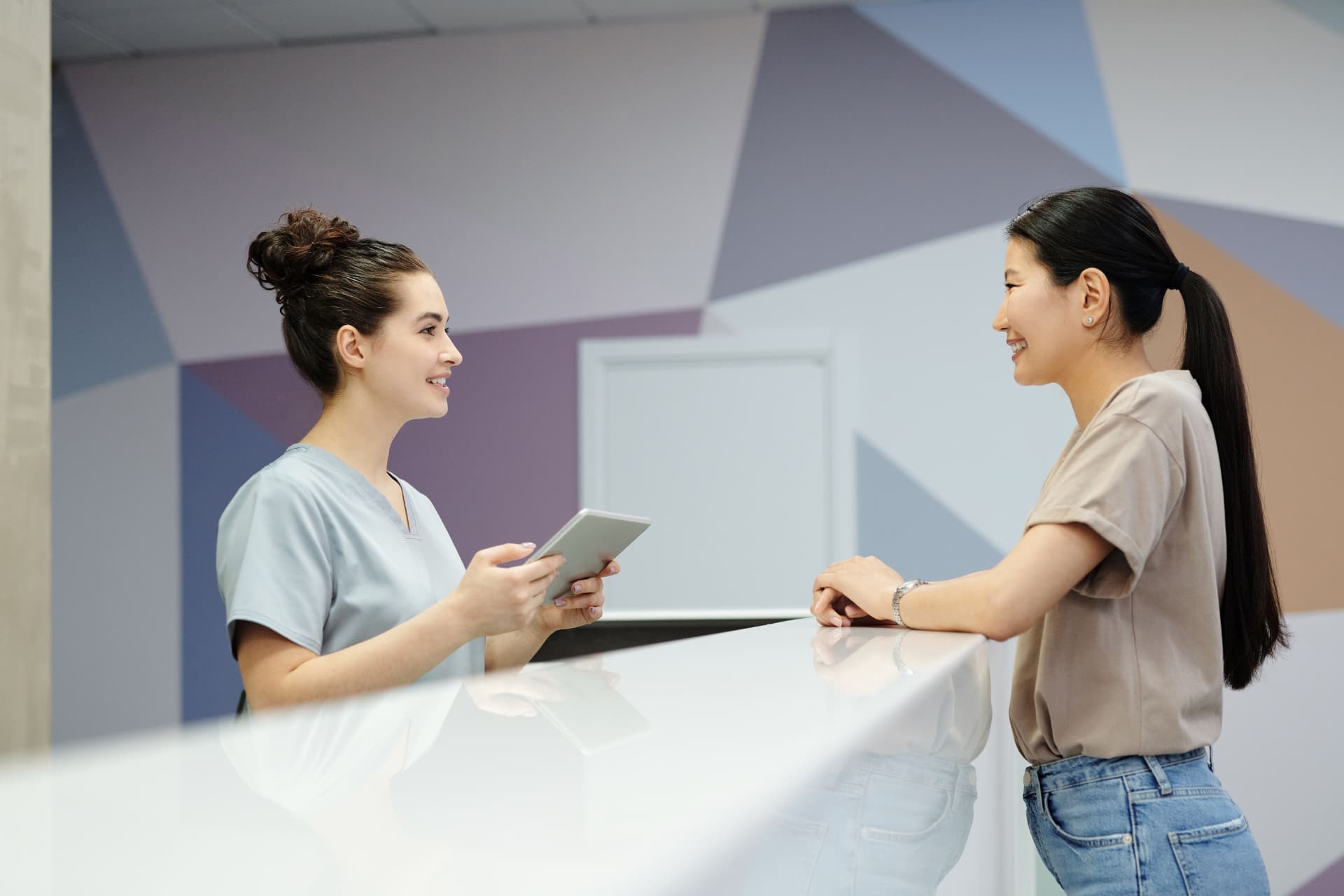 Receptionist greeting a patient at Harbour Dental