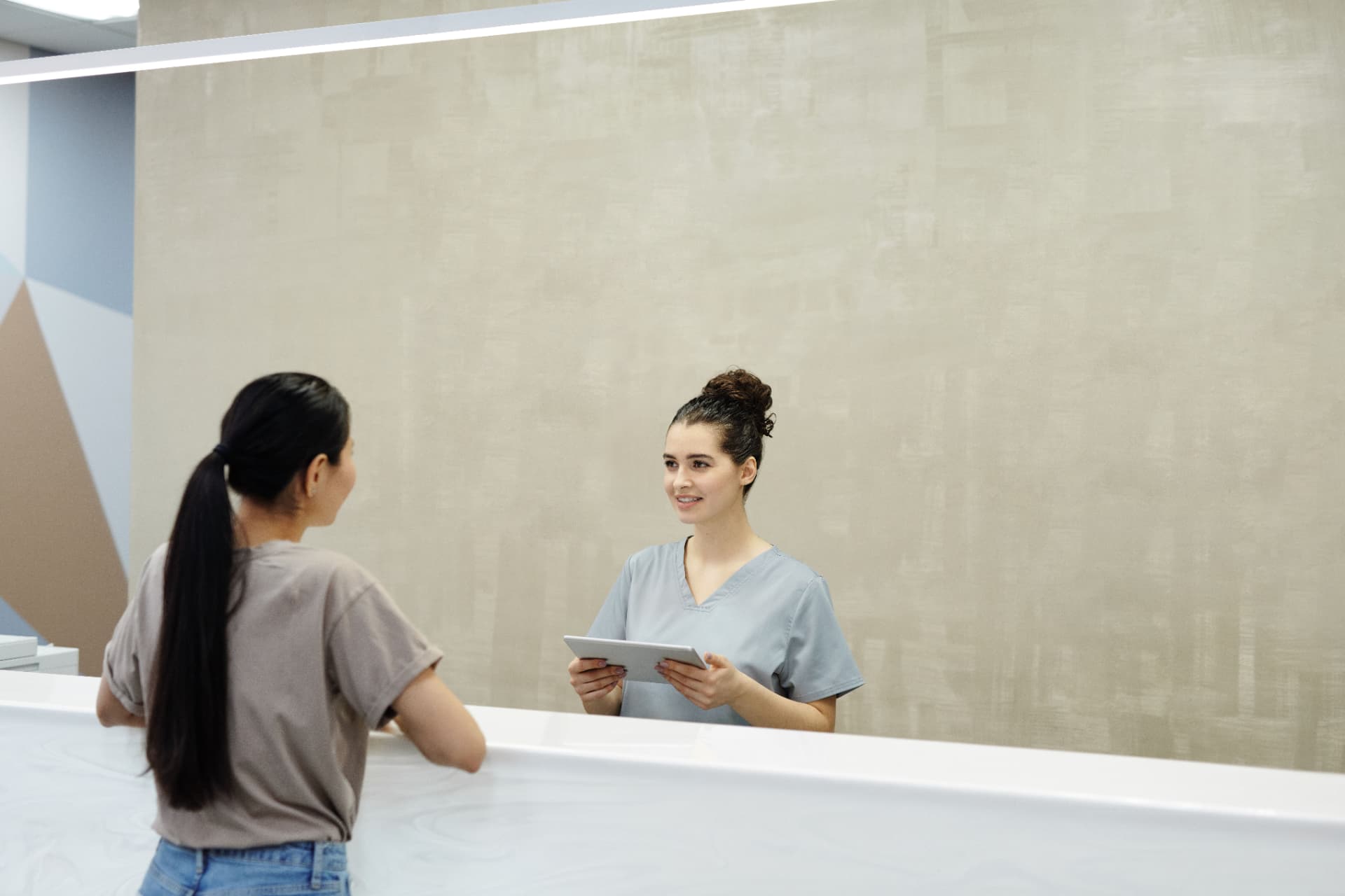 Harbour Dental receptionist welcoming a patient in Brighton