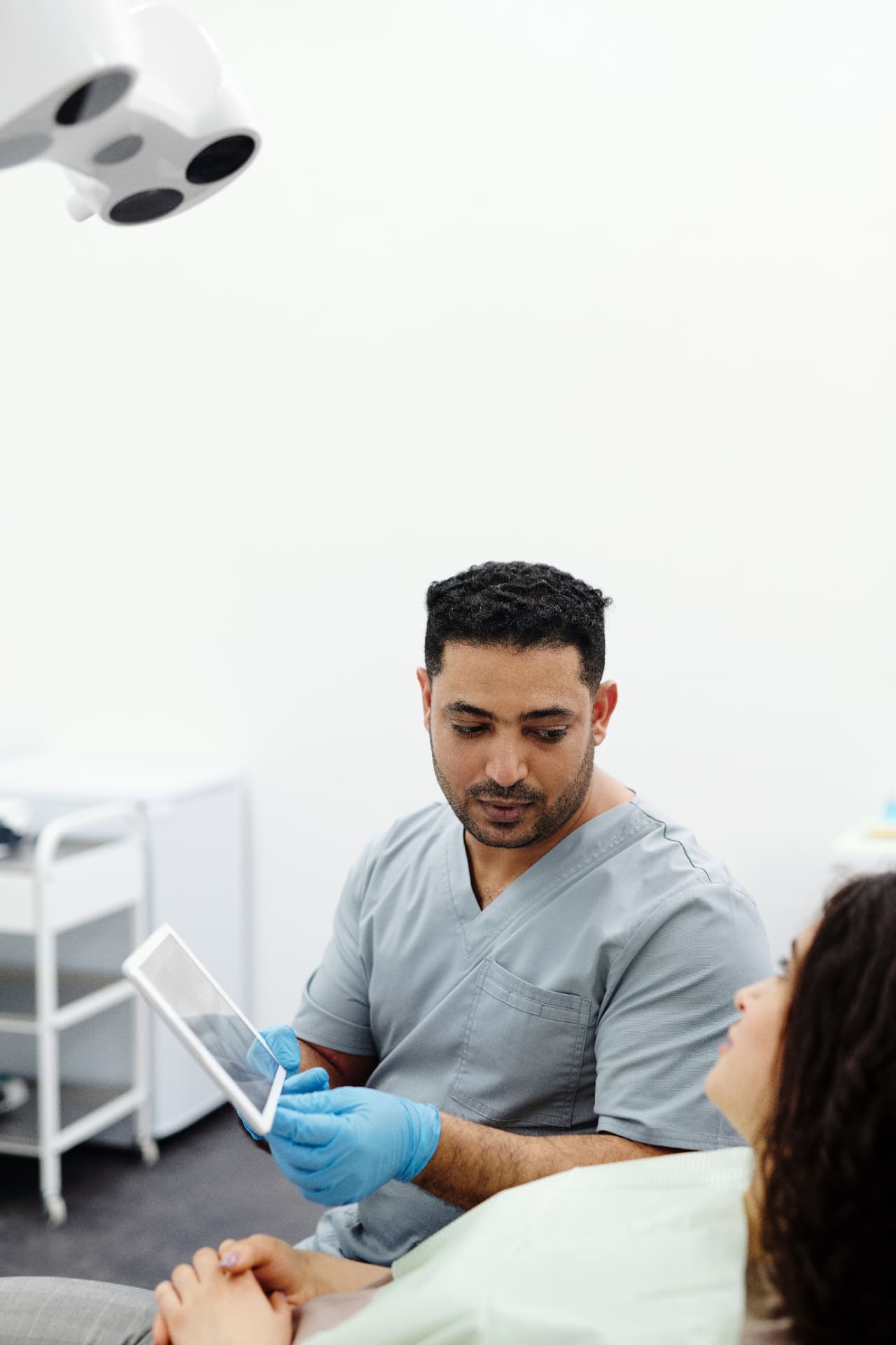 Dentist consulting with a patient about treatment options